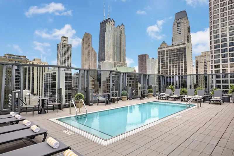 Rooftop pool at Viceroy Chicago with skyline views